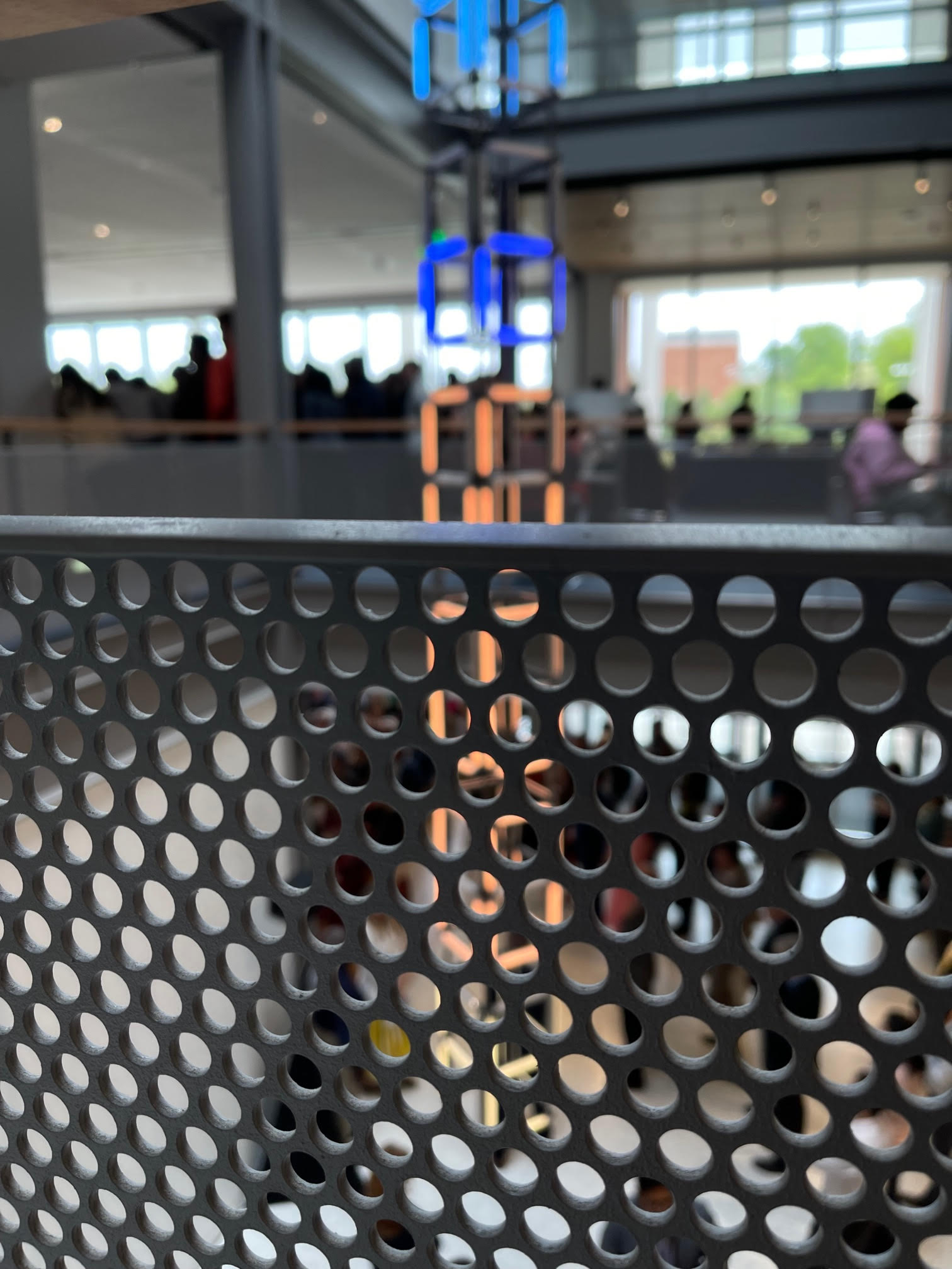 UVA data science building interior staircase with hanging digital art