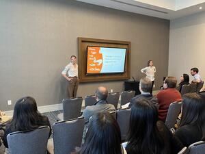 Madeleine Green and Juliette Sellgren present Green Eggs and Ham paper at the Economic Sciences Association conference in 2023.