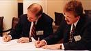 Executive Vice President and CFO Leonard W. Sandridge and IBM executive John Kelly authorize the IBM-U.Va. technology alliance.