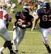 Tailback Tiki Barber finished his Cavalier career in 1996 as the all-time leading rusher in school history. He was named the 1996 ACC Player of the Year and a first-team GTE Academic All-American.