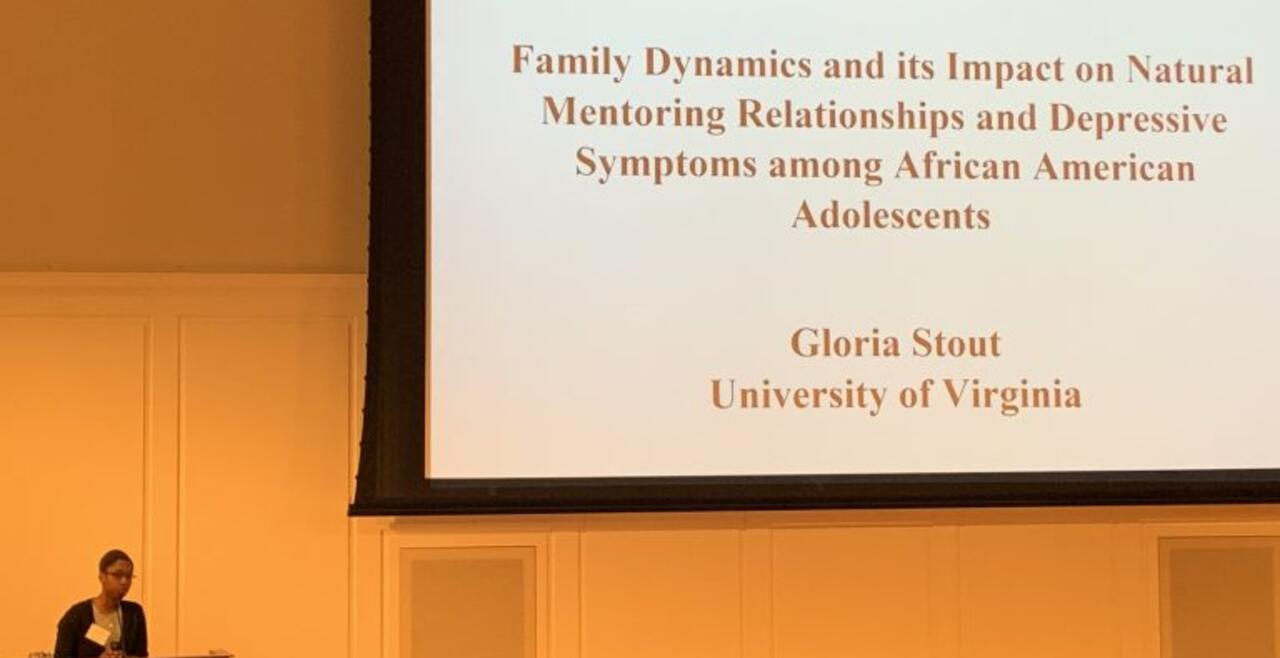 A photo of Gloria Stout presenting her Distinguished Major Program research