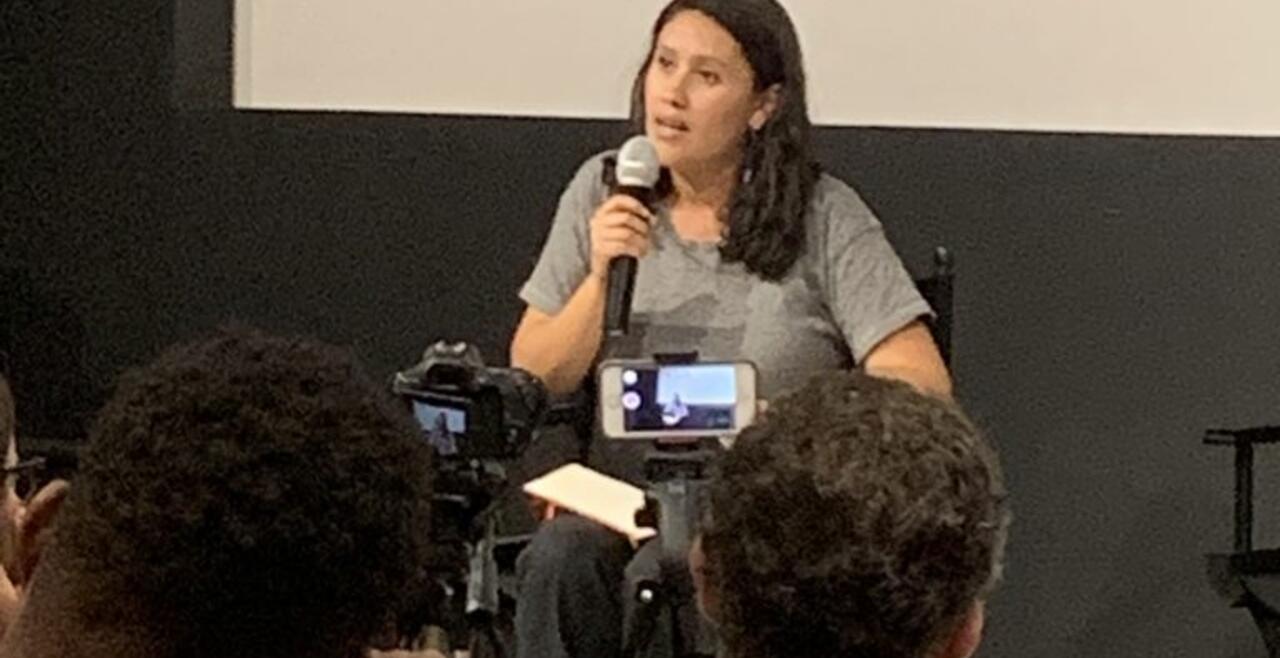 A photo of Andrea Negrete on a panel for the film screening of Ri K’echelaj Nich’on