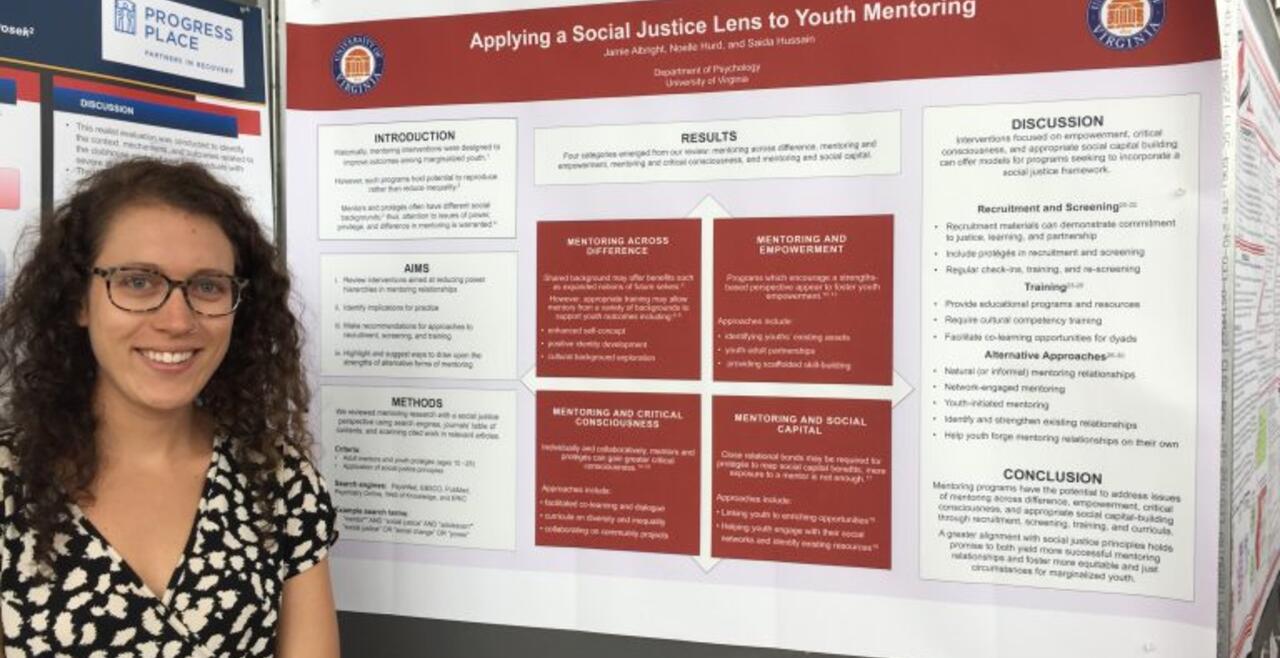 A photo of Jamie Albright presenting PHAD Lab research at the 16th Biennial Conference of the Society for Community Research and Action in Ottawa, Canada