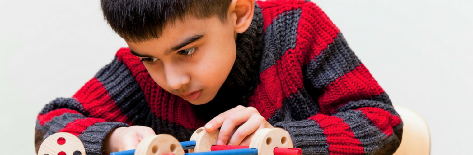 Child Building A Car