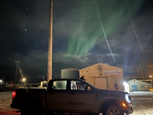 an image of the NEST with Northern Lights