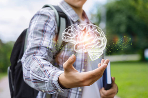 Youth holding brain icon