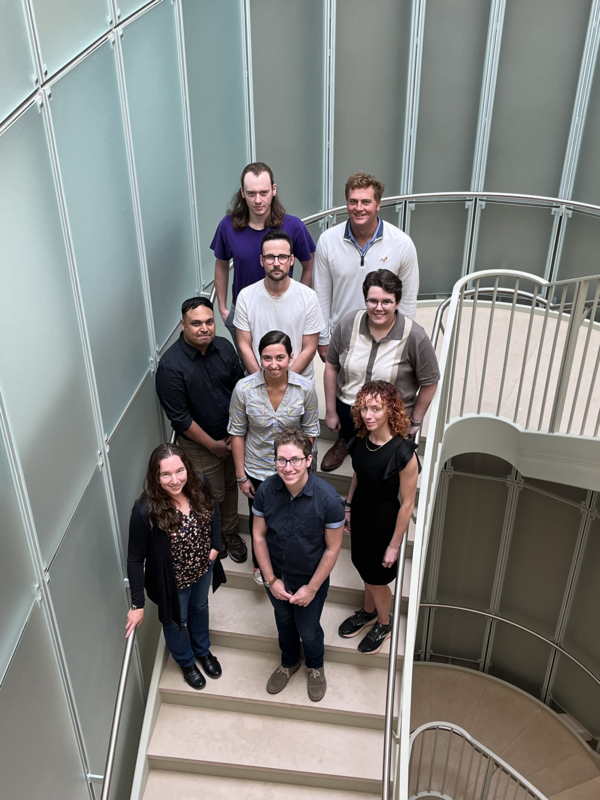photograph of people standing in a spiral staircase